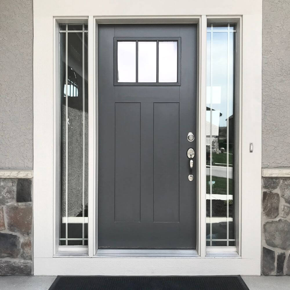 Modern black front door with sidelites on house