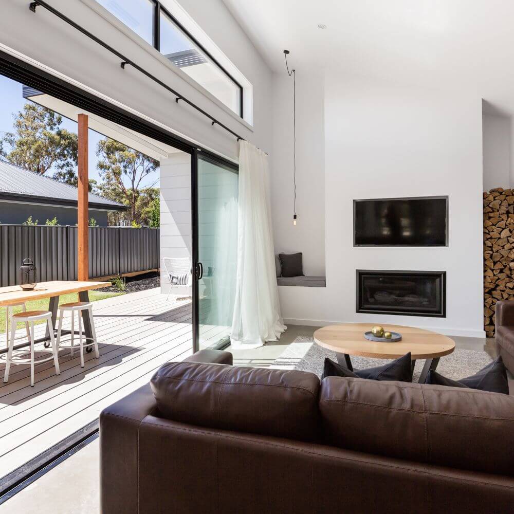 Modern living room interior with open patio door